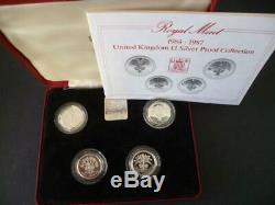 1984-1987 Uk Royal Mint Four Coin Silver Proof £1 Coin Coin Set Housed Red Case