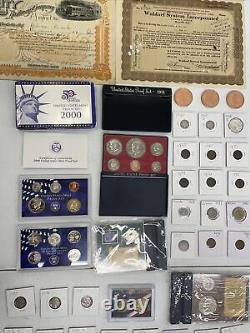 Estate Liquidation Lot ball cards, proof coins, proof sets, shares and more